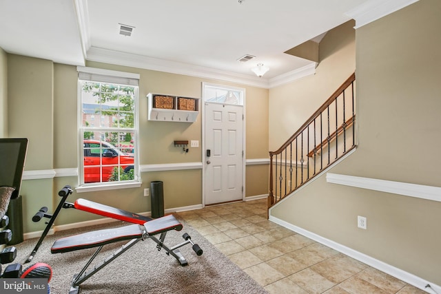 4631 Hudson St, Baltimore, MD 21224 - workout area with crown molding, tile patterned floors, and baseboards