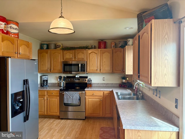 21 Georgie Ln, Richland, PA 17087 - kitchen featuring appliances with stainless steel finishes, a sink, light wood-style floors, light countertops, and lofted ceiling