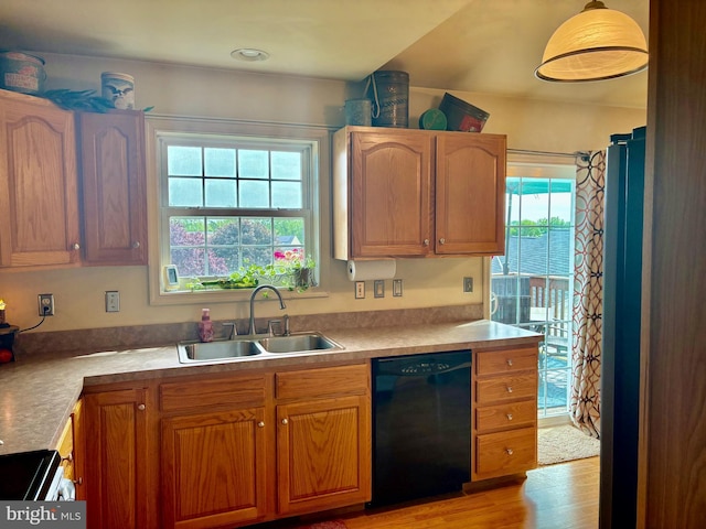 21 Georgie Ln, Richland, PA 17087 - kitchen featuring dishwasher, a sink, light wood-style flooring, light countertops, and brown cabinets