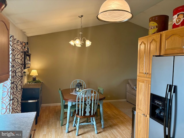 21 Georgie Ln, Richland, PA 17087 - dining room featuring vaulted ceiling, light wood-style floors, a chandelier, and baseboards
