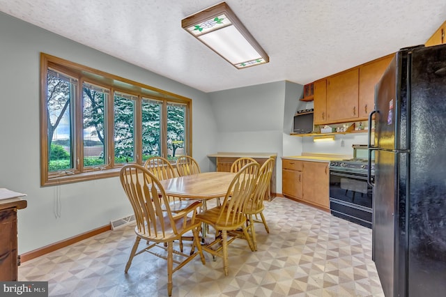 865 Windsor Perrineville Rd, East Windsor, NJ 08520 - dining space featuring light flooring, baseboards, and a textured ceiling