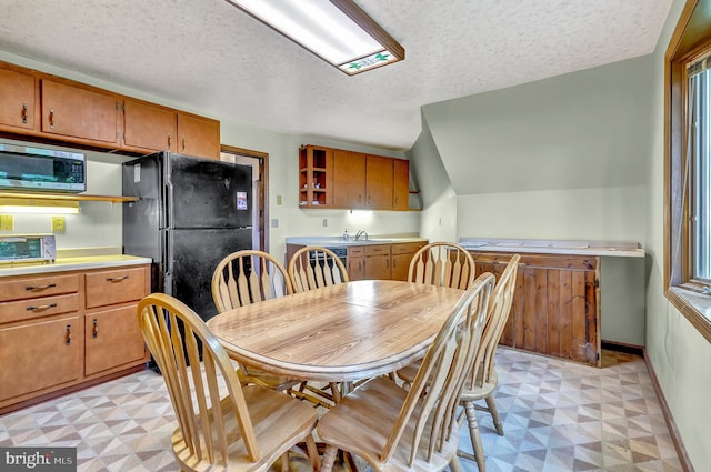 865 Windsor Perrineville Rd, East Windsor, NJ 08520 - dining area with light floors, a textured ceiling, baseboards, and plenty of natural light
