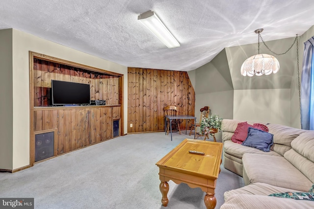 865 Windsor Perrineville Rd, East Windsor, NJ 08520 - carpeted living room with wood walls, lofted ceiling, a textured ceiling, and baseboards