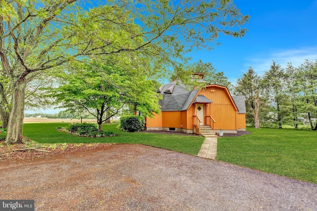 865 Windsor Perrineville Rd, East Windsor, NJ 08520 - view of front of home featuring a shingled roof, entry steps, a front lawn, and a barn