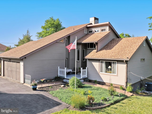 123 Windy Meadows Ct, Front Royal, VA 22630 - view of front of home with roof with shingles, central air condition unit, and a chimney