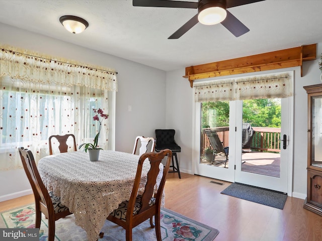 123 Windy Meadows Ct, Front Royal, VA 22630 - dining space with light wood-style flooring, a ceiling fan, and baseboards