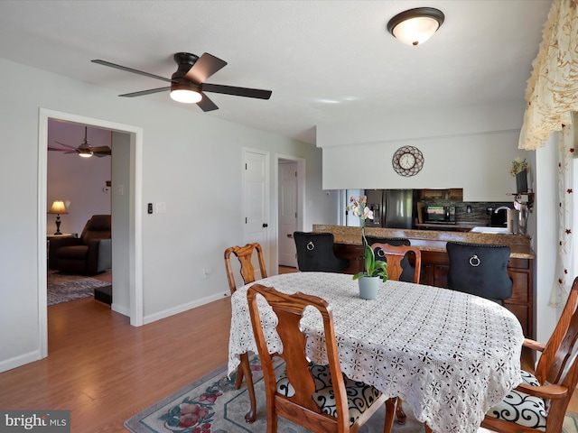 123 Windy Meadows Ct, Front Royal, VA 22630 - dining area featuring wood finished floors, a ceiling fan, and baseboards