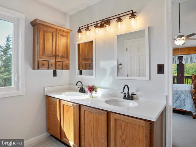 123 Windy Meadows Ct, Front Royal, VA 22630 - ensuite bathroom featuring double vanity, a ceiling fan, and baseboards
