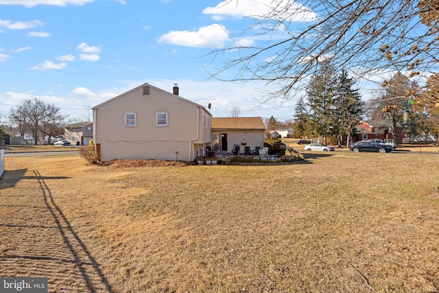 2300 Andover Rd, Cinnaminson, NJ 08077 - back of house featuring a yard and a chimney