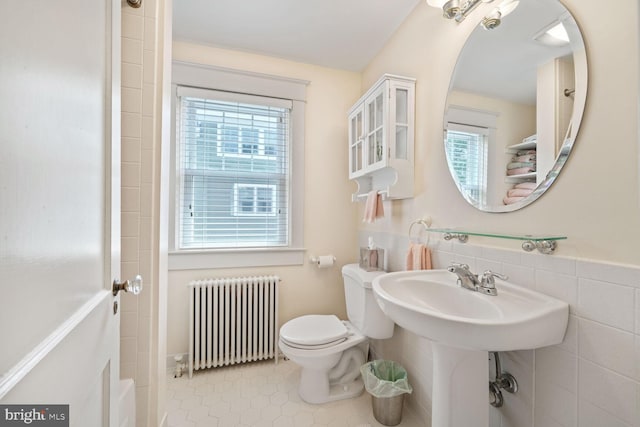 103 E Monroe Ave, Alexandria, VA 22301 - bathroom featuring radiator, tile patterned floors, a shower, and a tub to relax in