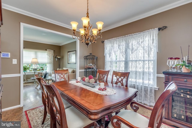8 Adams Ln, Hainesport, NJ 08036 - dining space featuring a chandelier, wood finished floors, crown molding, and baseboards