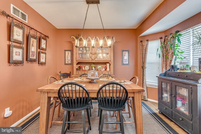 8 Adams Ln, Hainesport, NJ 08036 - dining area featuring a chandelier and baseboards