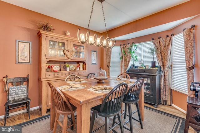 8 Adams Ln, Hainesport, NJ 08036 - dining room with baseboards, light wood-style floors, and a chandelier