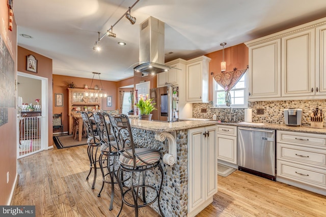 8 Adams Ln, Hainesport, NJ 08036 - kitchen featuring cream cabinetry, stainless steel appliances, island range hood, and light wood-style floors