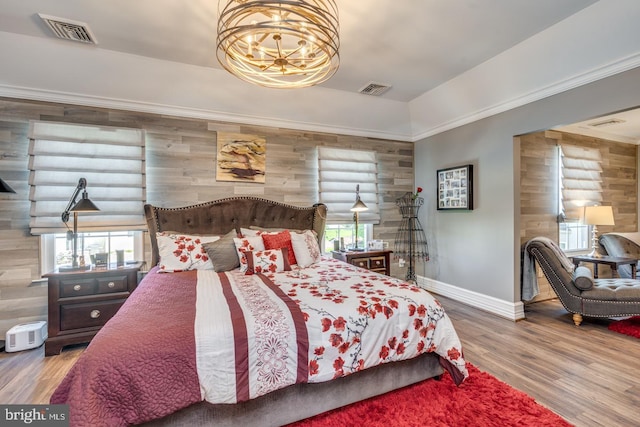 8 Adams Ln, Hainesport, NJ 08036 - bedroom with wood walls, baseboards, a chandelier, wood finished floors, and ornamental molding