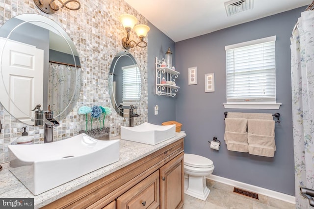 8 Adams Ln, Hainesport, NJ 08036 - full bath with plenty of natural light, vanity, baseboards, and toilet