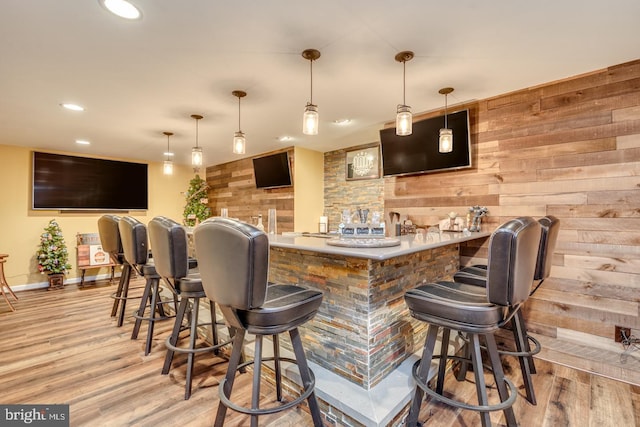 8 Adams Ln, Hainesport, NJ 08036 - indoor wet bar with light wood-style flooring, recessed lighting, wood walls, baseboards, and hanging light fixtures