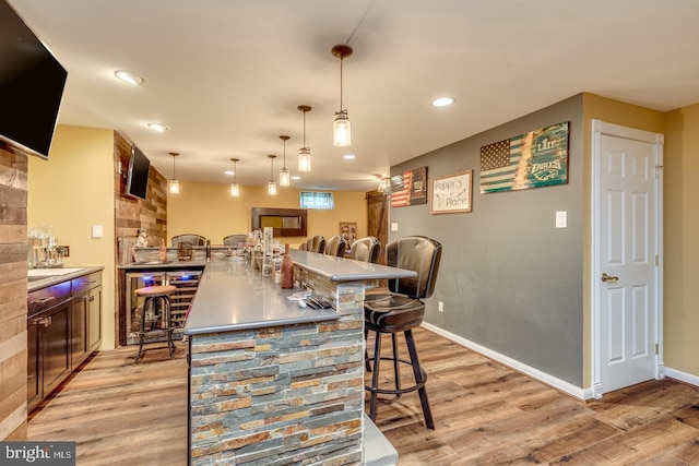 8 Adams Ln, Hainesport, NJ 08036 - kitchen with a breakfast bar, light wood-style flooring, recessed lighting, hanging light fixtures, and baseboards