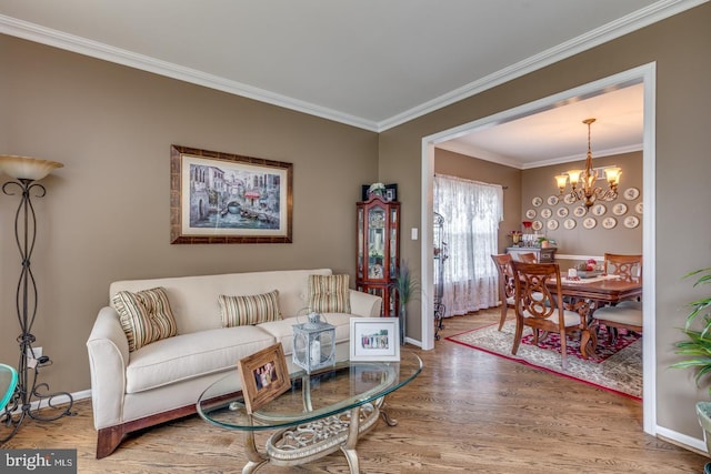 8 Adams Ln, Hainesport, NJ 08036 - living area featuring wood finished floors, a chandelier, crown molding, and baseboards