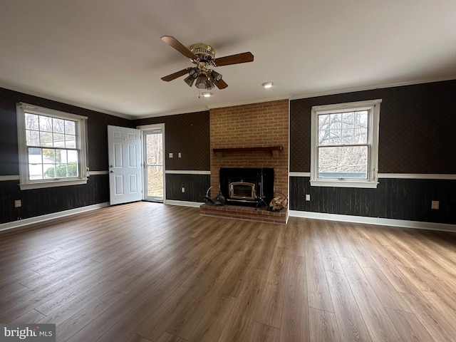 519 Orchard Dale Dr, Clear Brook, VA 22624 - unfurnished living room with crown molding, wood finished floors, a ceiling fan, and a wainscoted wall