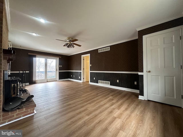 519 Orchard Dale Dr, Clear Brook, VA 22624 - unfurnished living room with ceiling fan, crown molding, wood finished floors, and wainscoting