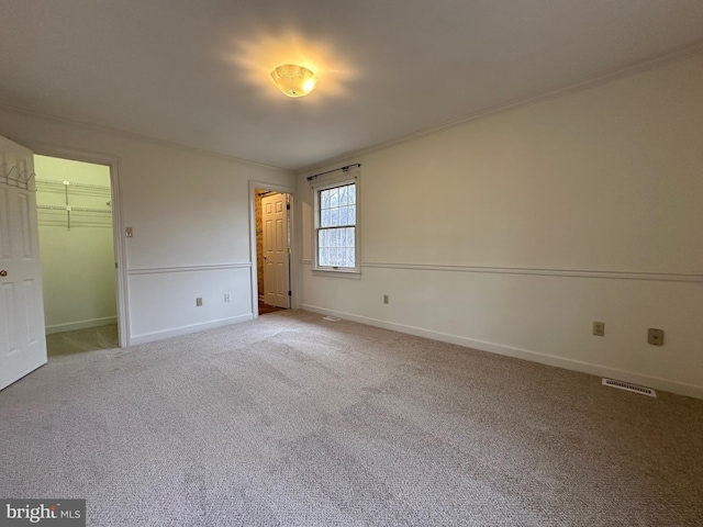 519 Orchard Dale Dr, Clear Brook, VA 22624 - unfurnished bedroom featuring carpet, baseboards, ornamental molding, a spacious closet, and a closet
