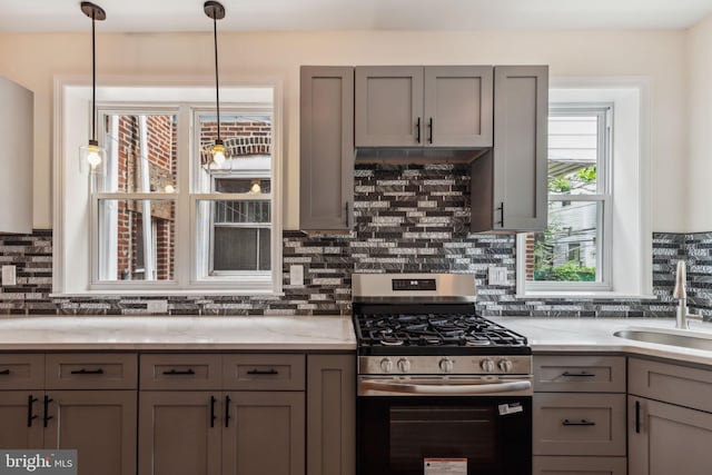 5724 Pine St, Philadelphia, PA 19143 - kitchen featuring stainless steel range with gas cooktop, a sink, gray cabinets, and tasteful backsplash