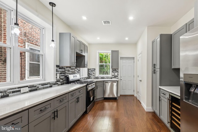 5724 Pine St, Philadelphia, PA 19143 - kitchen with stainless steel appliances, gray cabinetry, wine cooler, tasteful backsplash, and recessed lighting