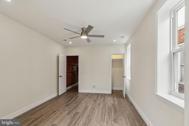 5724 Pine St, Philadelphia, PA 19143 - unfurnished bedroom featuring wood finished floors, a spacious closet, recessed lighting, baseboards, and a closet
