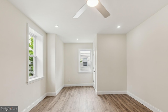 5724 Pine St, Philadelphia, PA 19143 - empty room with healthy amount of natural light, wood finished floors, baseboards, and recessed lighting