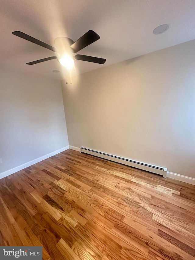 205 W Wishart St, Philadelphia, PA 19133 - spare room with ceiling fan, a baseboard radiator, wood finished floors, and baseboards