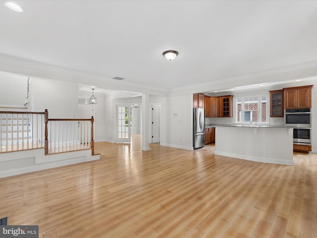 138 Park Side Cir, Ocean Pines, MD 21811 - unfurnished living room featuring light wood-type flooring, crown molding, and recessed lighting