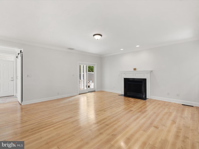 138 Park Side Cir, Ocean Pines, MD 21811 - unfurnished living room featuring crown molding, a fireplace with flush hearth, light wood-type flooring, and recessed lighting