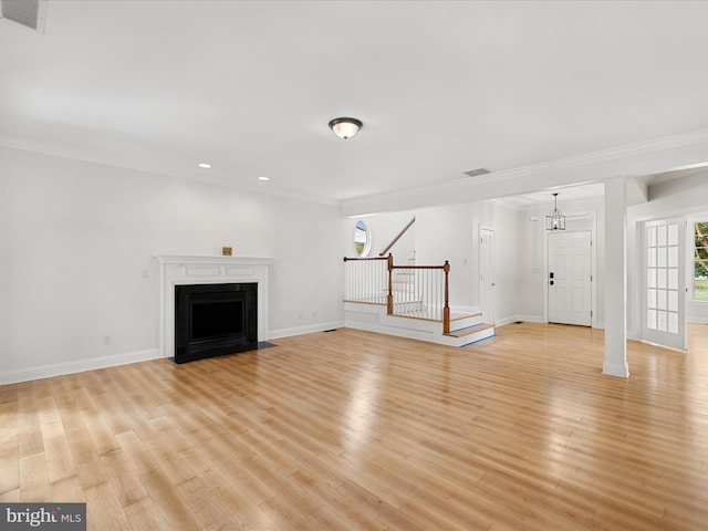 138 Park Side Cir, Ocean Pines, MD 21811 - unfurnished living room featuring stairway, light wood-type flooring, recessed lighting, a fireplace with flush hearth, and crown molding