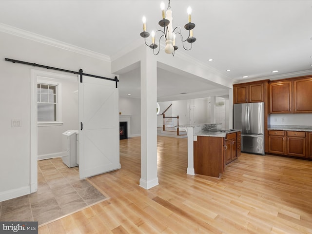 138 Park Side Cir, Ocean Pines, MD 21811 - kitchen with freestanding refrigerator, a chandelier, ornamental molding, recessed lighting, and open floor plan