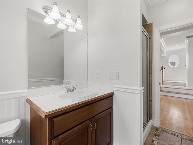138 Park Side Cir, Ocean Pines, MD 21811 - full bath featuring crown molding, a wainscoted wall, vanity, a shower stall, and a decorative wall
