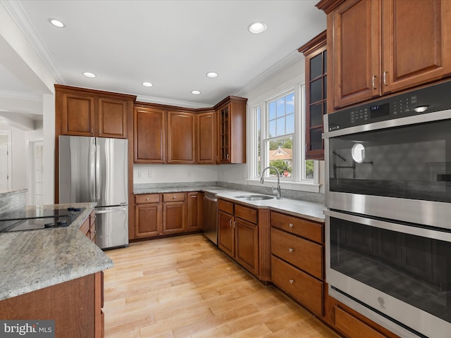138 Park Side Cir, Ocean Pines, MD 21811 - kitchen featuring appliances with stainless steel finishes, crown molding, brown cabinets, glass insert cabinets, and recessed lighting