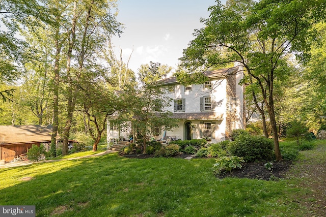 2 Earles Ln, Newtown Square, PA 19073 - view of front of home featuring a front lawn, a chimney, and stucco siding