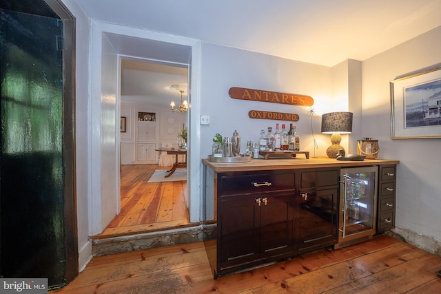 2 Earles Ln, Newtown Square, PA 19073 - indoor dry bar featuring wine cooler, wood-type flooring, and a chandelier