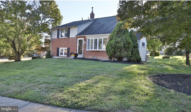 454 N Manor Dr, Media, PA 19063 - view of front of house with brick siding, a front lawn, and a chimney