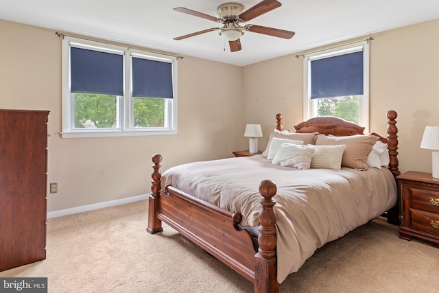 454 N Manor Dr, Media, PA 19063 - carpeted bedroom featuring multiple windows, baseboards, and ceiling fan