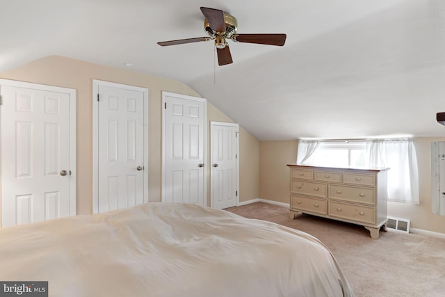 454 N Manor Dr, Media, PA 19063 - bedroom with lofted ceiling, baseboards, two closets, carpet floors, and a ceiling fan