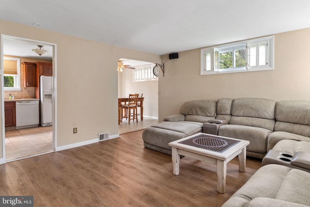 454 N Manor Dr, Media, PA 19063 - living area with light wood finished floors, healthy amount of natural light, and a ceiling fan