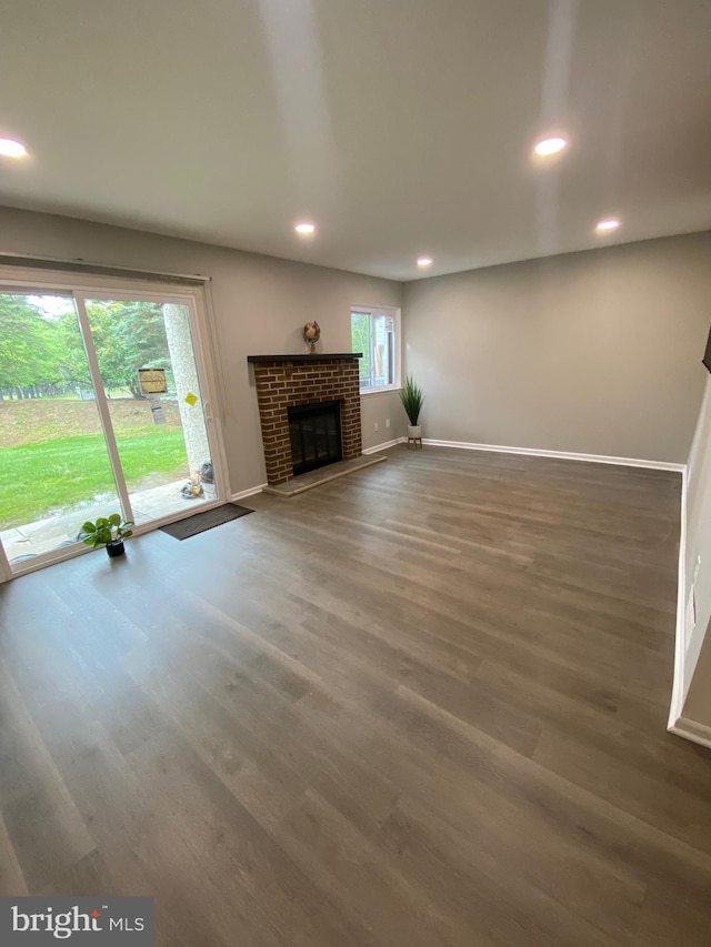 605 Bismark Way, King Of Prussia, PA 19406 - unfurnished living room featuring baseboards, recessed lighting, wood finished floors, and a fireplace