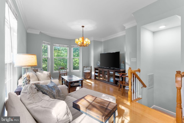43433 Blair Park Sq, Ashburn, VA 20147 - living room with light wood finished floors, a chandelier, ornamental molding, and baseboards