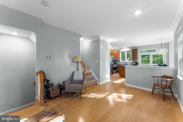 43433 Blair Park Sq, Ashburn, VA 20147 - living area featuring light wood finished floors, recessed lighting, baseboards, and stairway