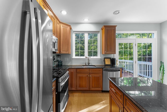 43433 Blair Park Sq, Ashburn, VA 20147 - kitchen with appliances with stainless steel finishes, a sink, plenty of natural light, light wood finished floors, and recessed lighting