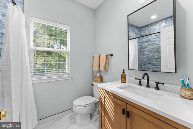 43433 Blair Park Sq, Ashburn, VA 20147 - bathroom with vanity, plenty of natural light, marble finish flooring, and toilet