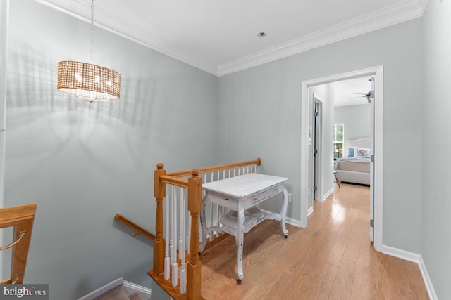 43433 Blair Park Sq, Ashburn, VA 20147 - corridor with an upstairs landing, light wood-type flooring, ornamental molding, baseboards, and a chandelier