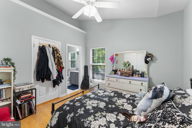 43433 Blair Park Sq, Ashburn, VA 20147 - bedroom featuring light wood finished floors, lofted ceiling, a ceiling fan, and ensuite bath